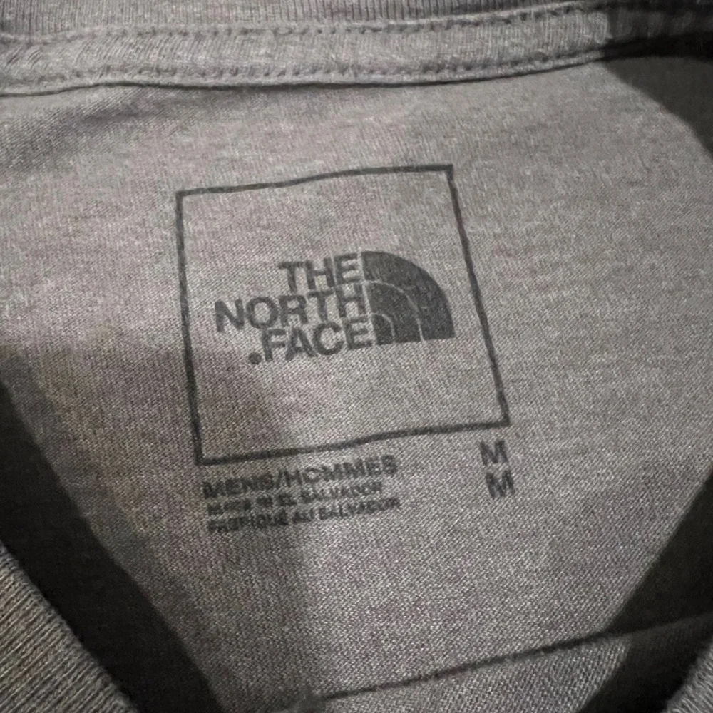 The North Face Gray Tee with Blue and Red Logo